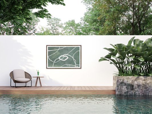 relaxing poolside area with framed art on the wall