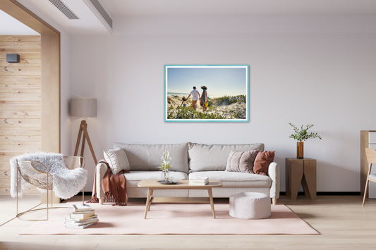 Living room with a family photo on the wall in a bright blue frame
