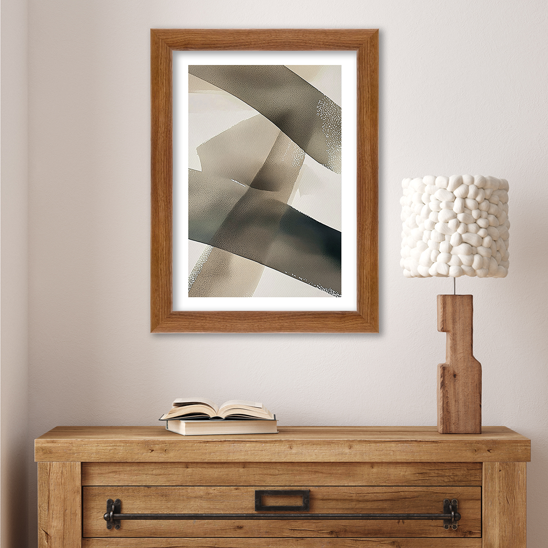 light walnut hudson valley wall frame framing an abstract art piece and hanging over a dresser