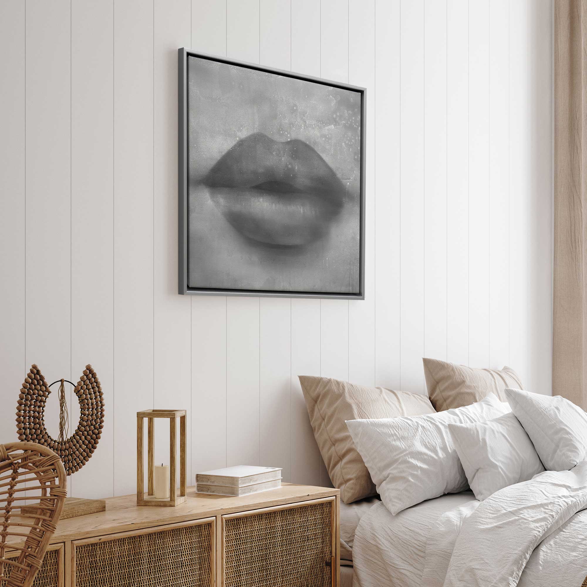 Whispered kiss black & white canvas print in a silver frame