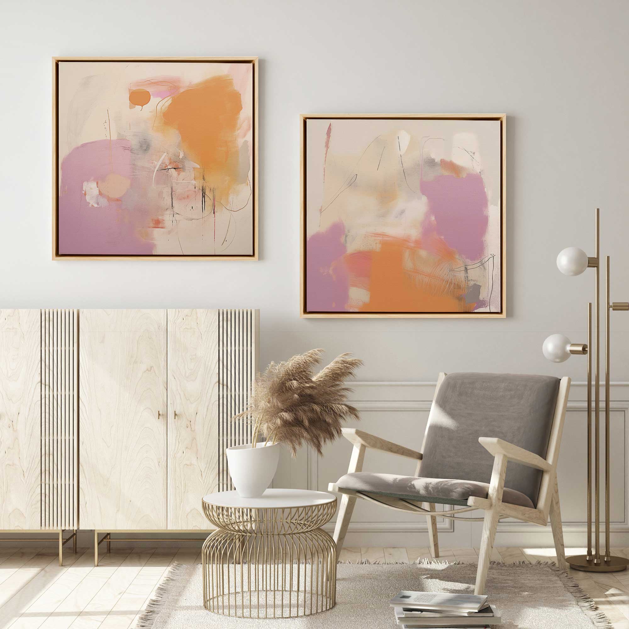 cotton candy set of 2 abstract art pieces in natural wood frames hanging in a living room