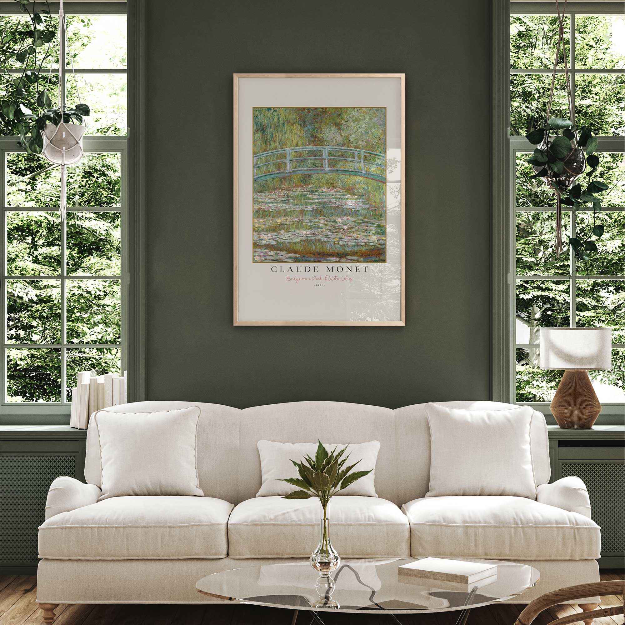 Bridge over a pond of water lilies by monet in a maple frame hanging over a couch