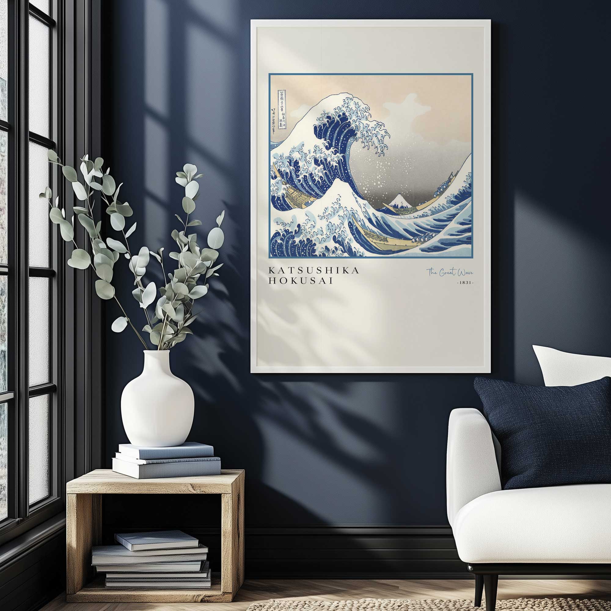 The Great Wave by Hokusai print in a white frame hanging in navy living room