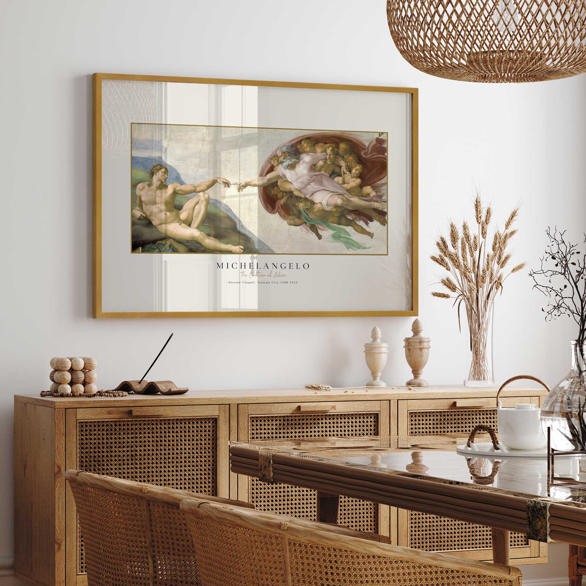 The Creation of Adam by Michelangelo print in a gold frame hanging in dining room