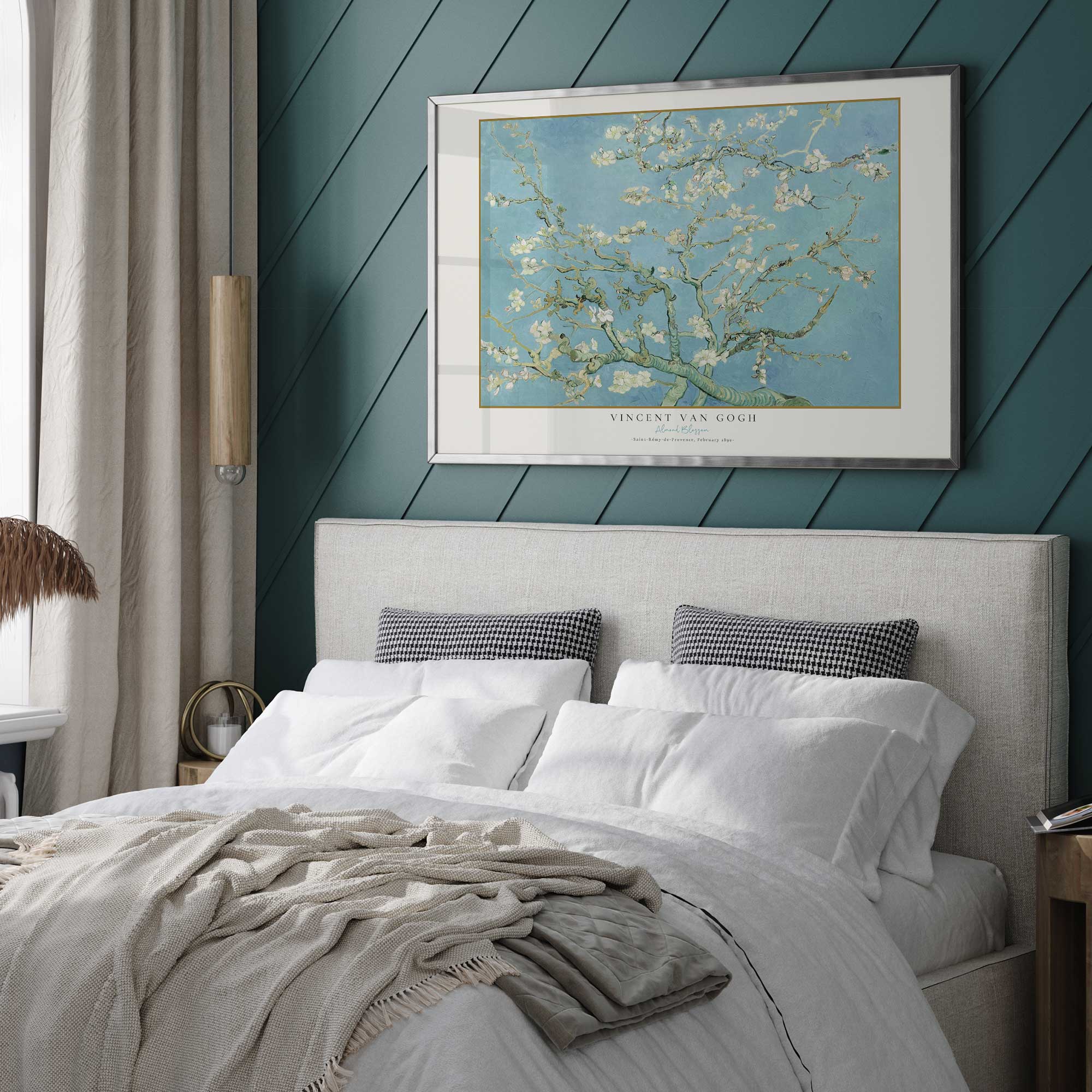 Van Gogh's almond blossom print in a frame over the bed