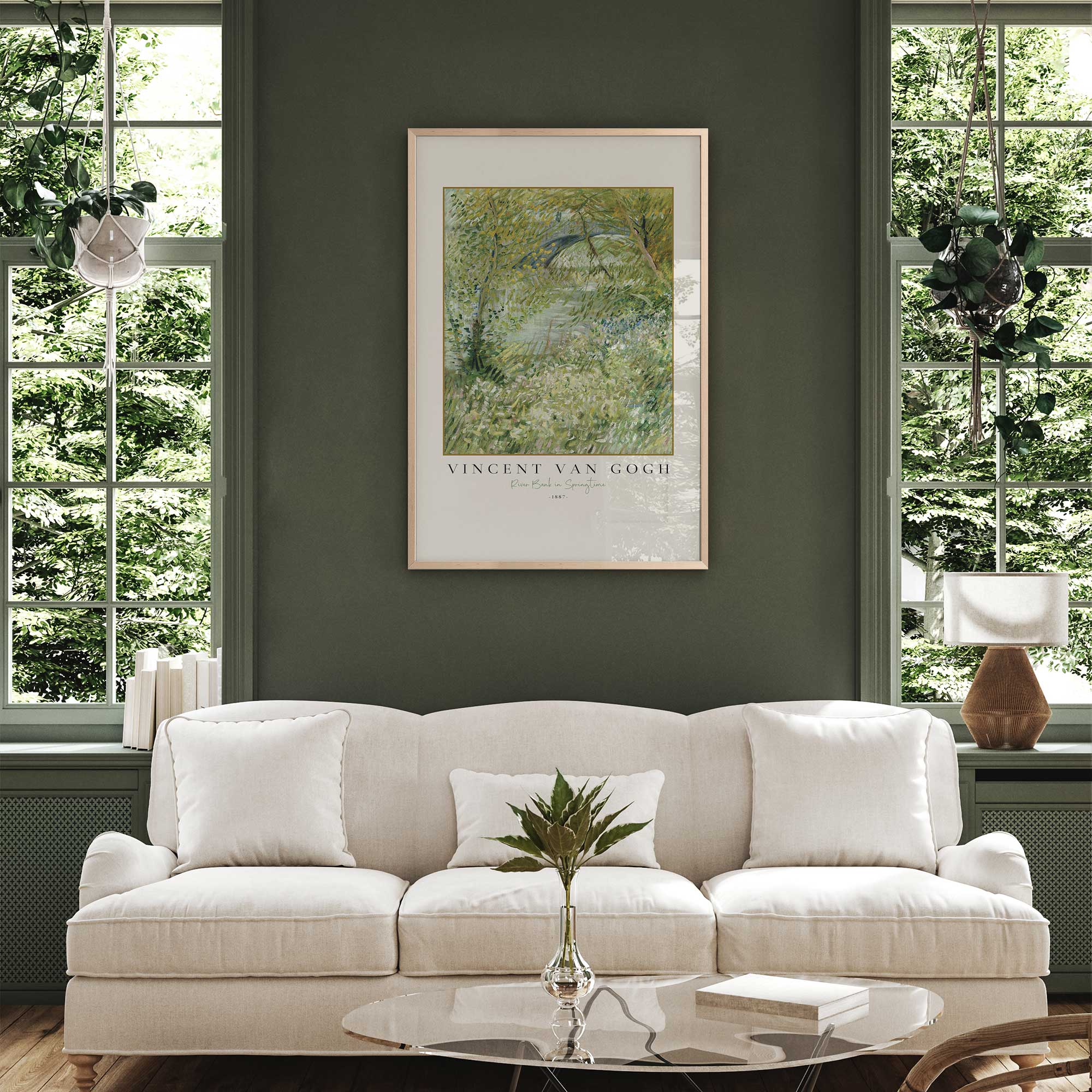 Van Gogh's river bank in springtime print in a maple frame hanging in green living room