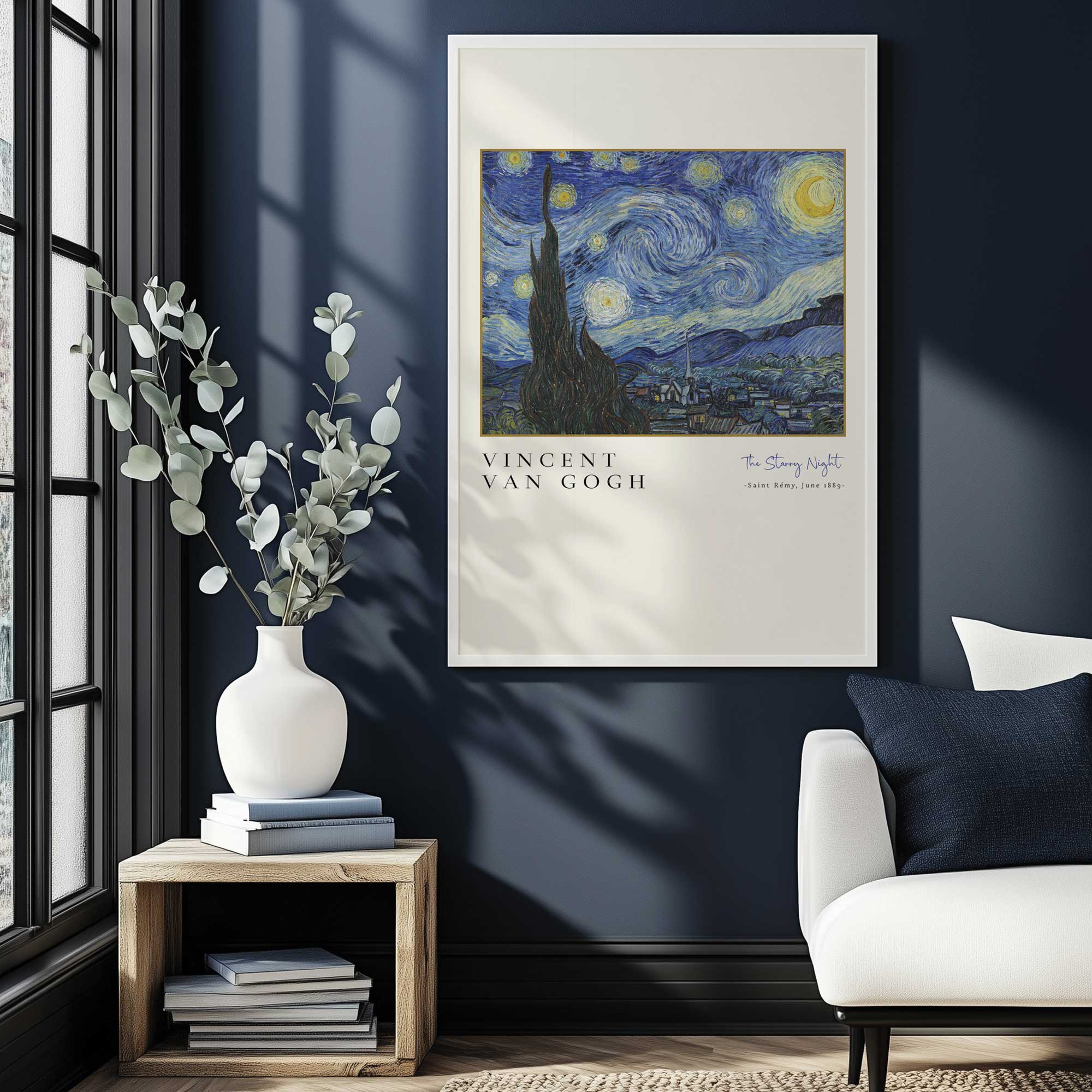 van gogh's starry night print in a white frame hanging in living room