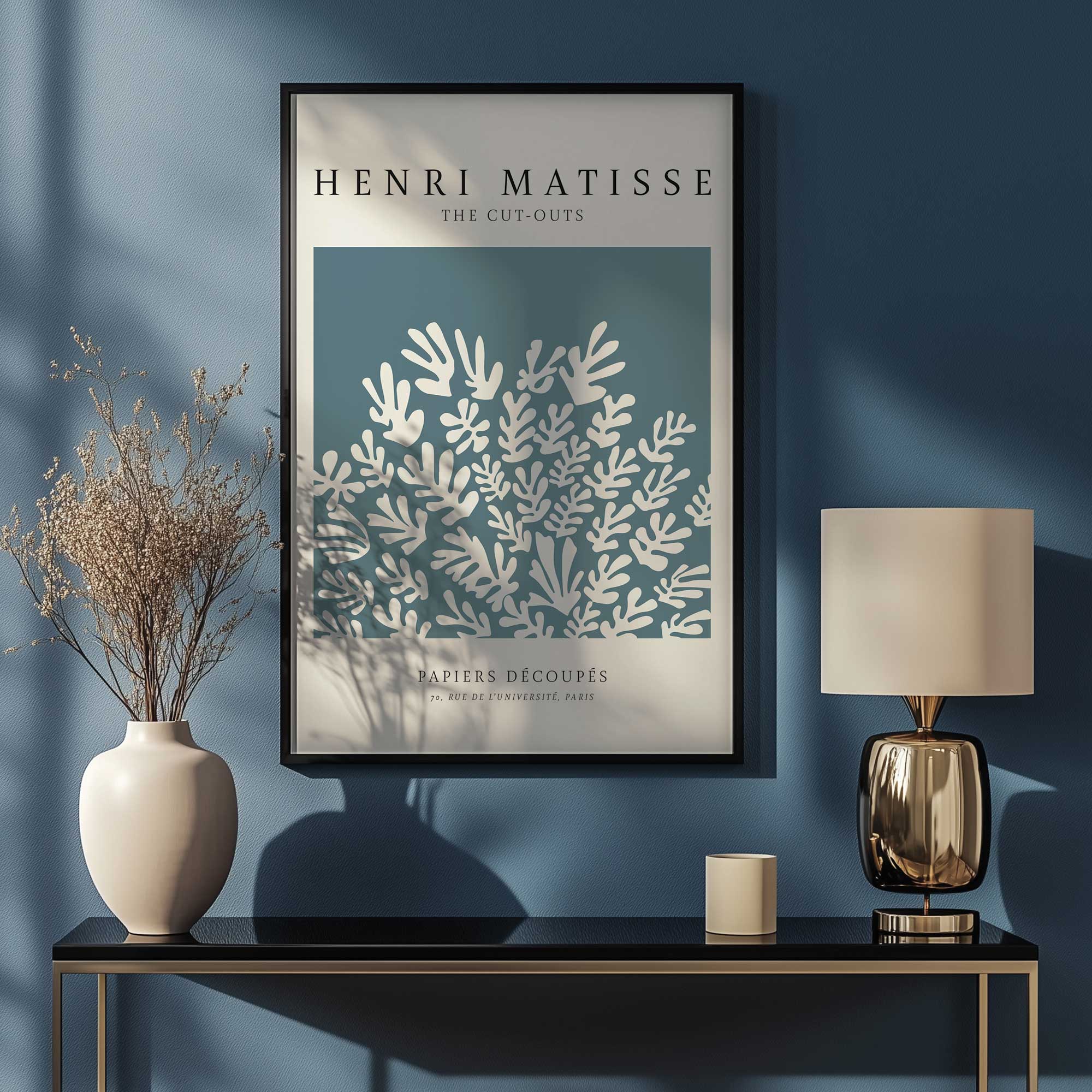 Matisse's la Gerbe in midnight blue print hanging above a console table in an entryway