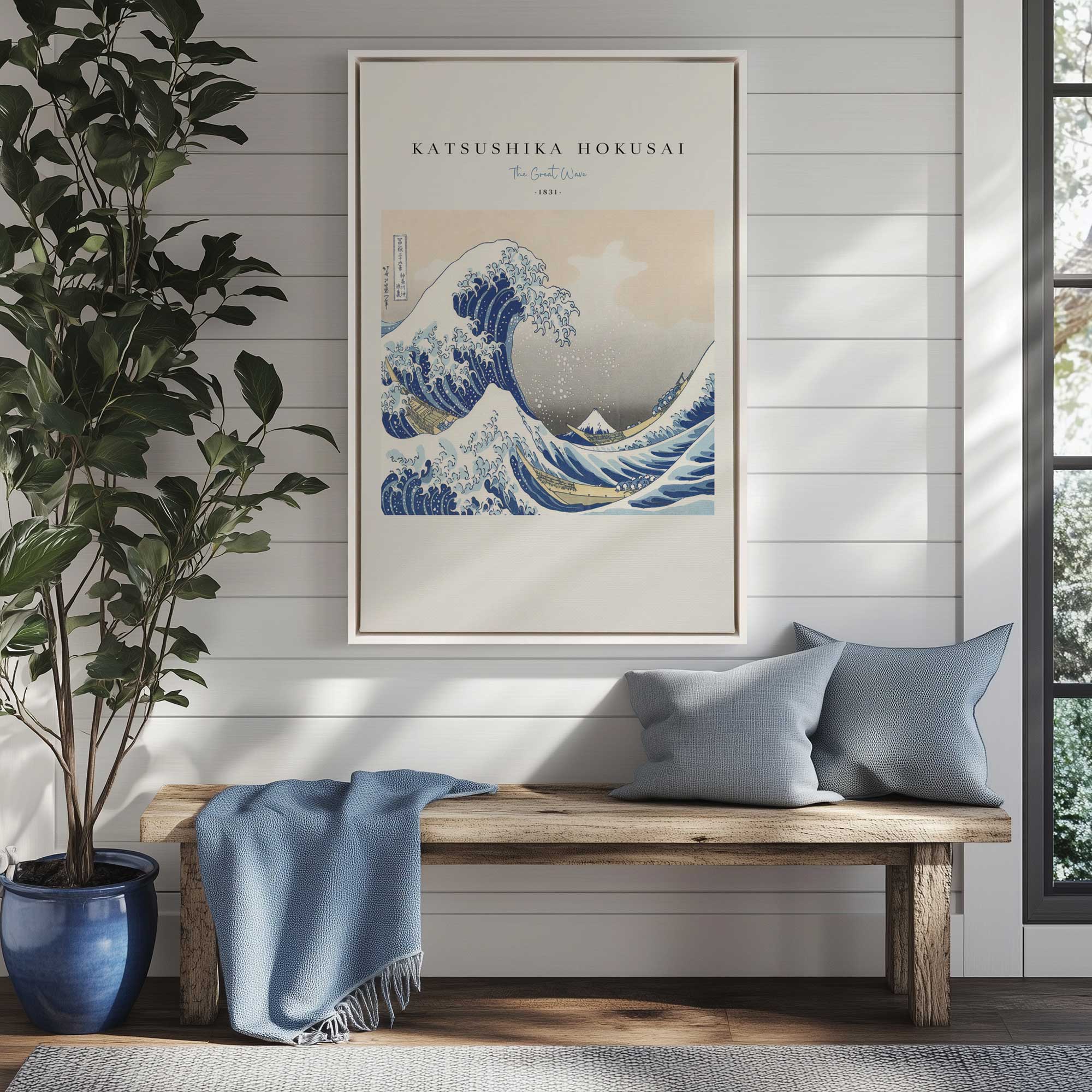 The Great Wave by Hokusai v2 on canvas in a white floater frame hanging above bench