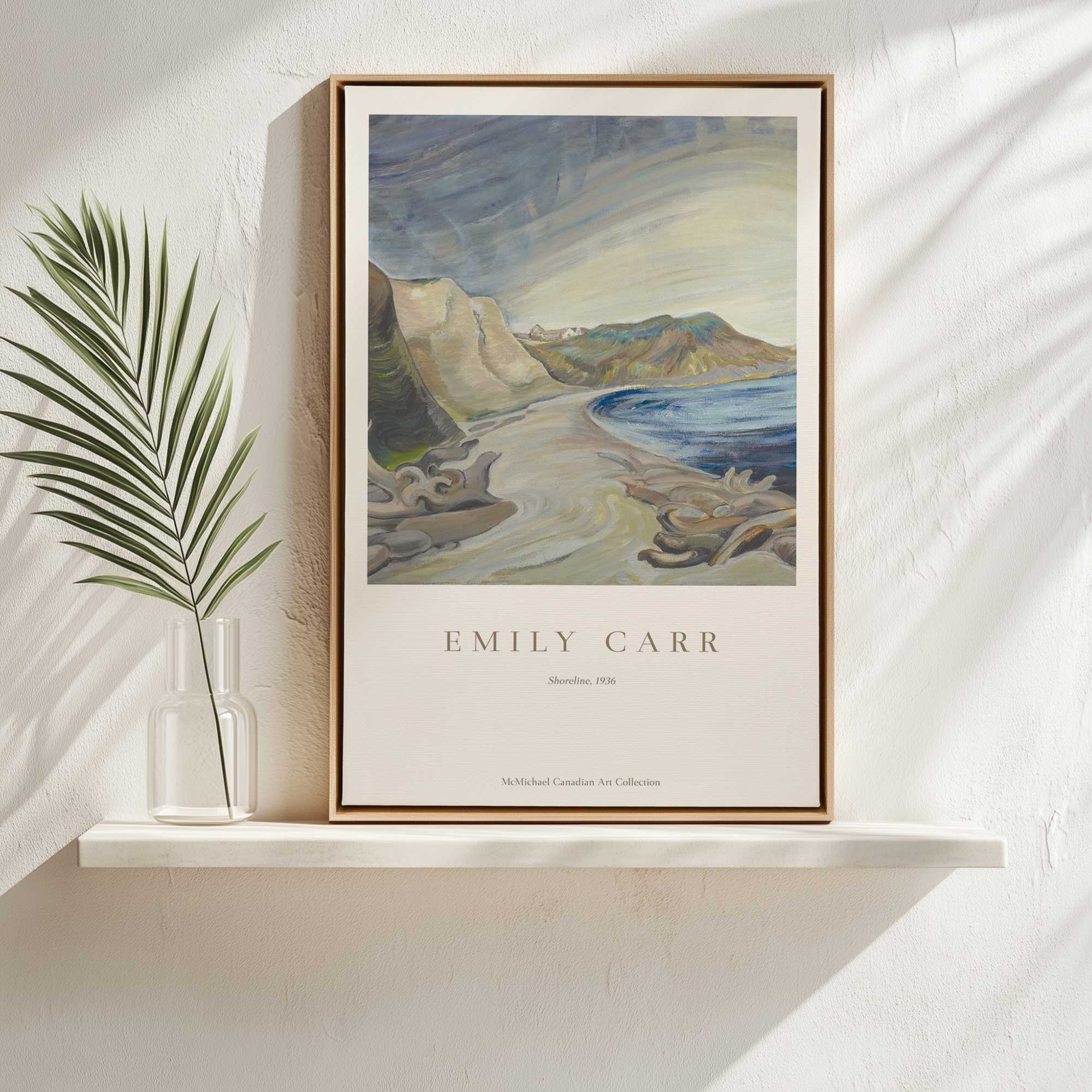 shoreline by emily carr print on canvas in a maple floater frame sitting on a shelf