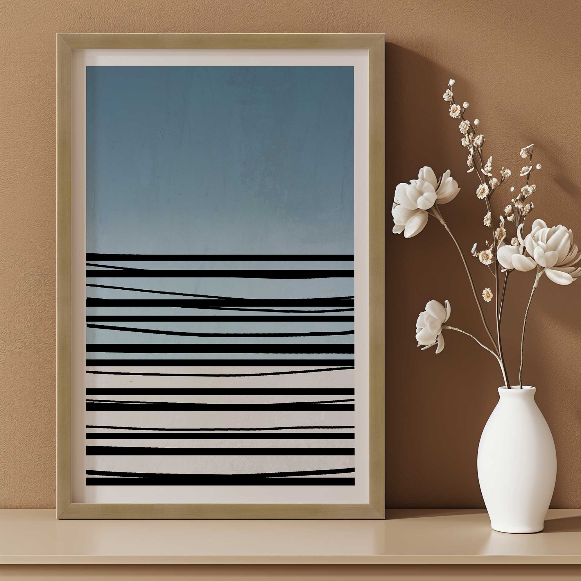 twilight stripes v2 framed abstract print on a dresser next to a vase