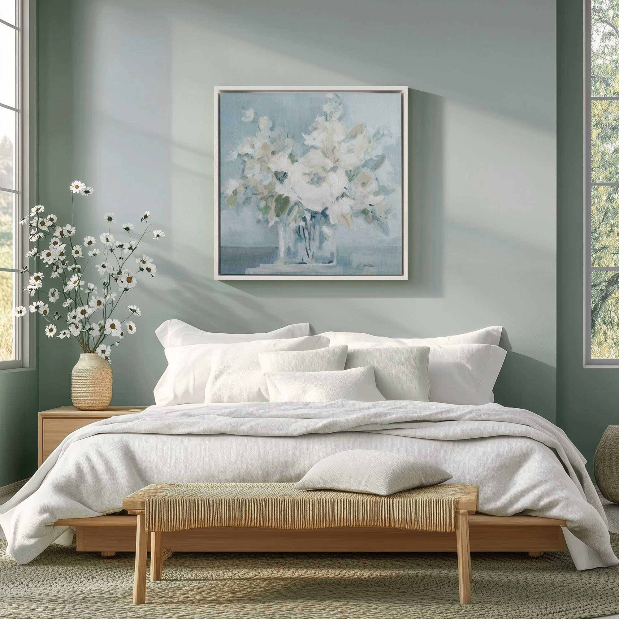 tranquil white blossoms print hanging above bed