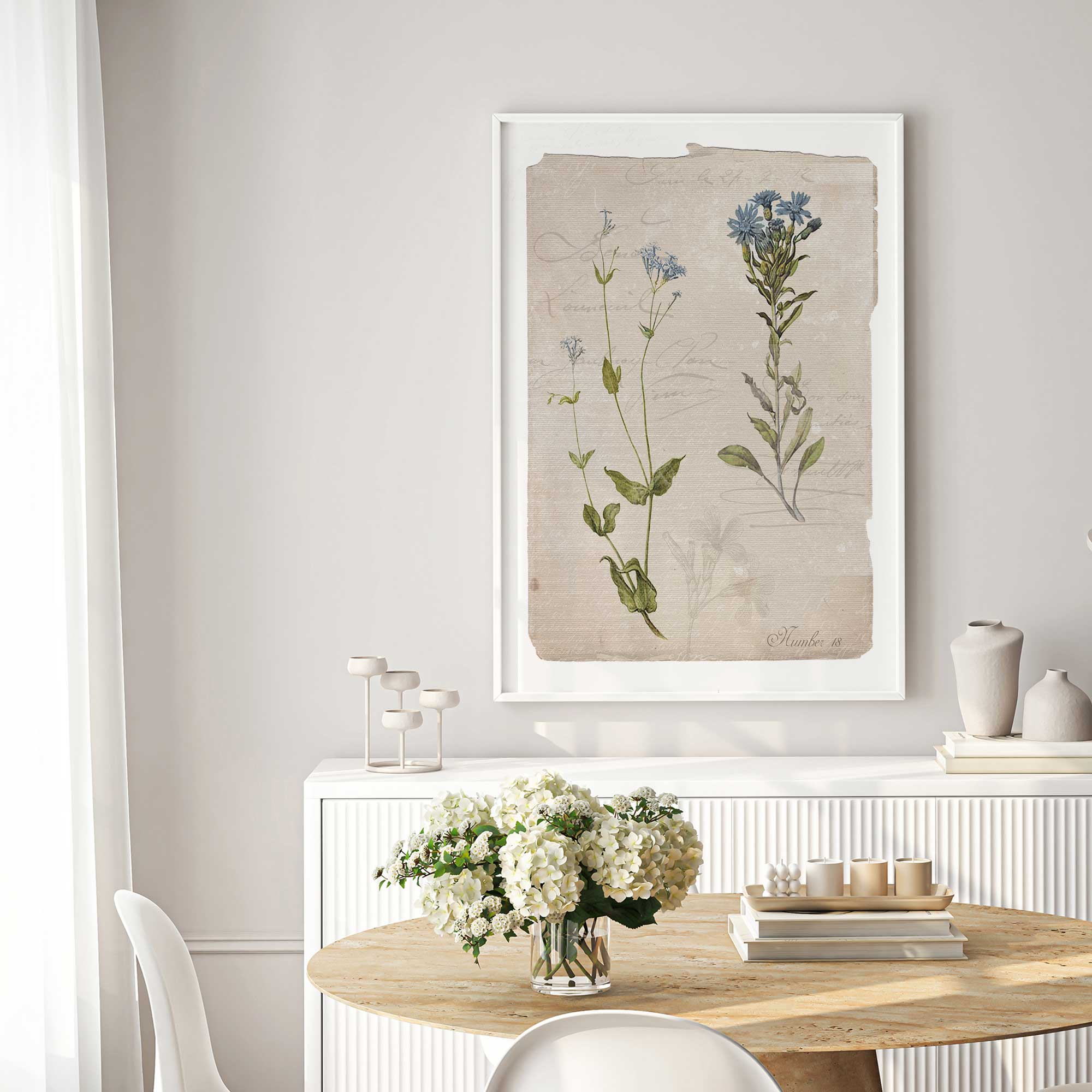Blue botanical study II print hanging in a bright dining room