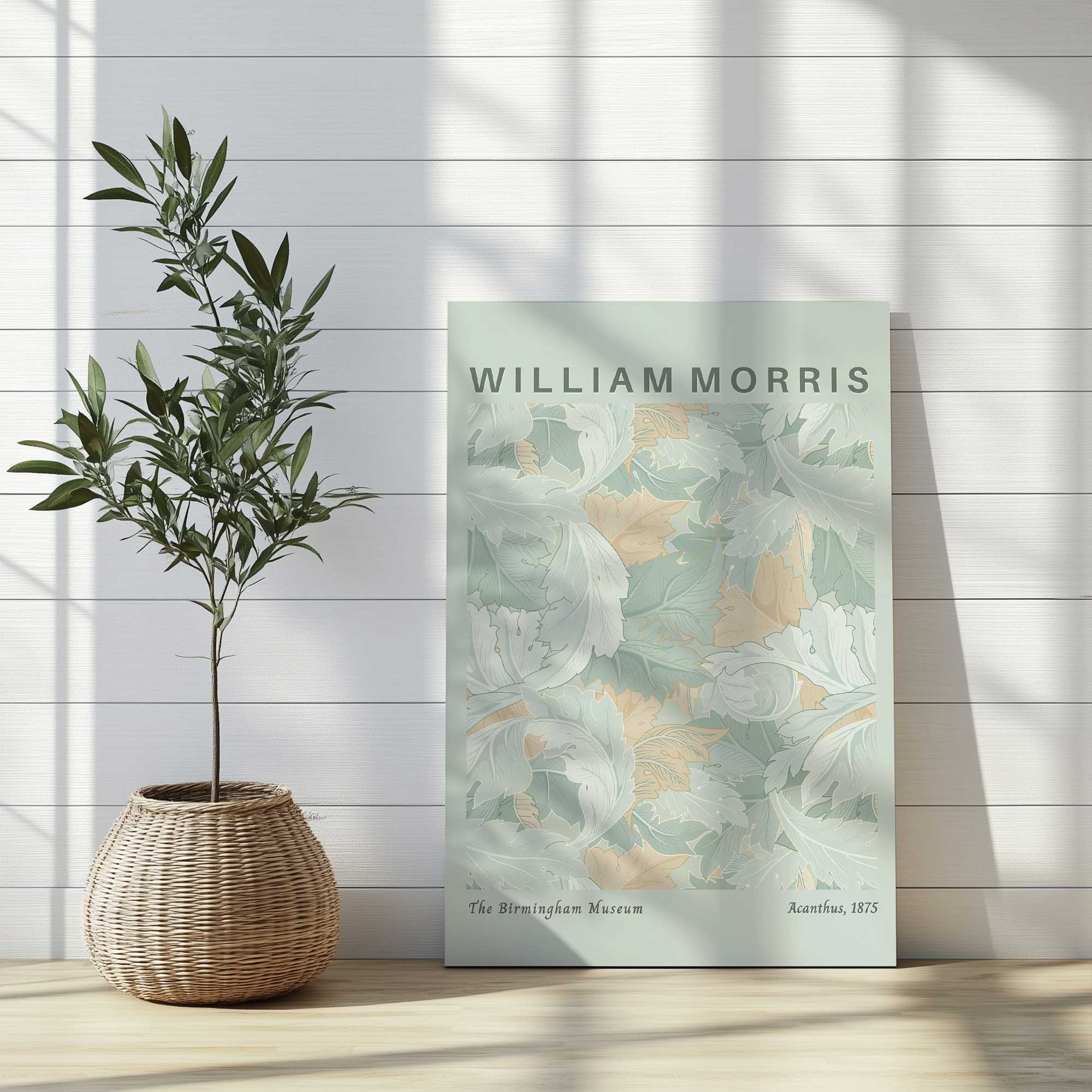 wrapped canvas of soft green acanthus by William Morris leaning against the wall in an entryway