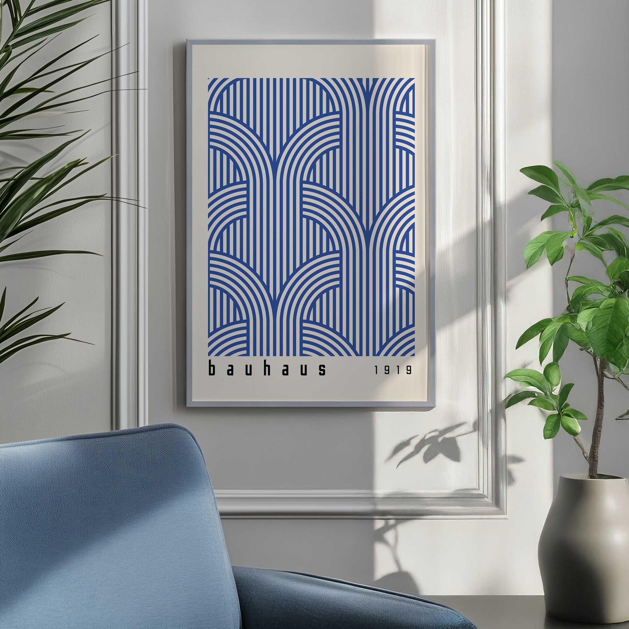 Bauhaus abstract arches in blue framed print hanging in a dark sitting room