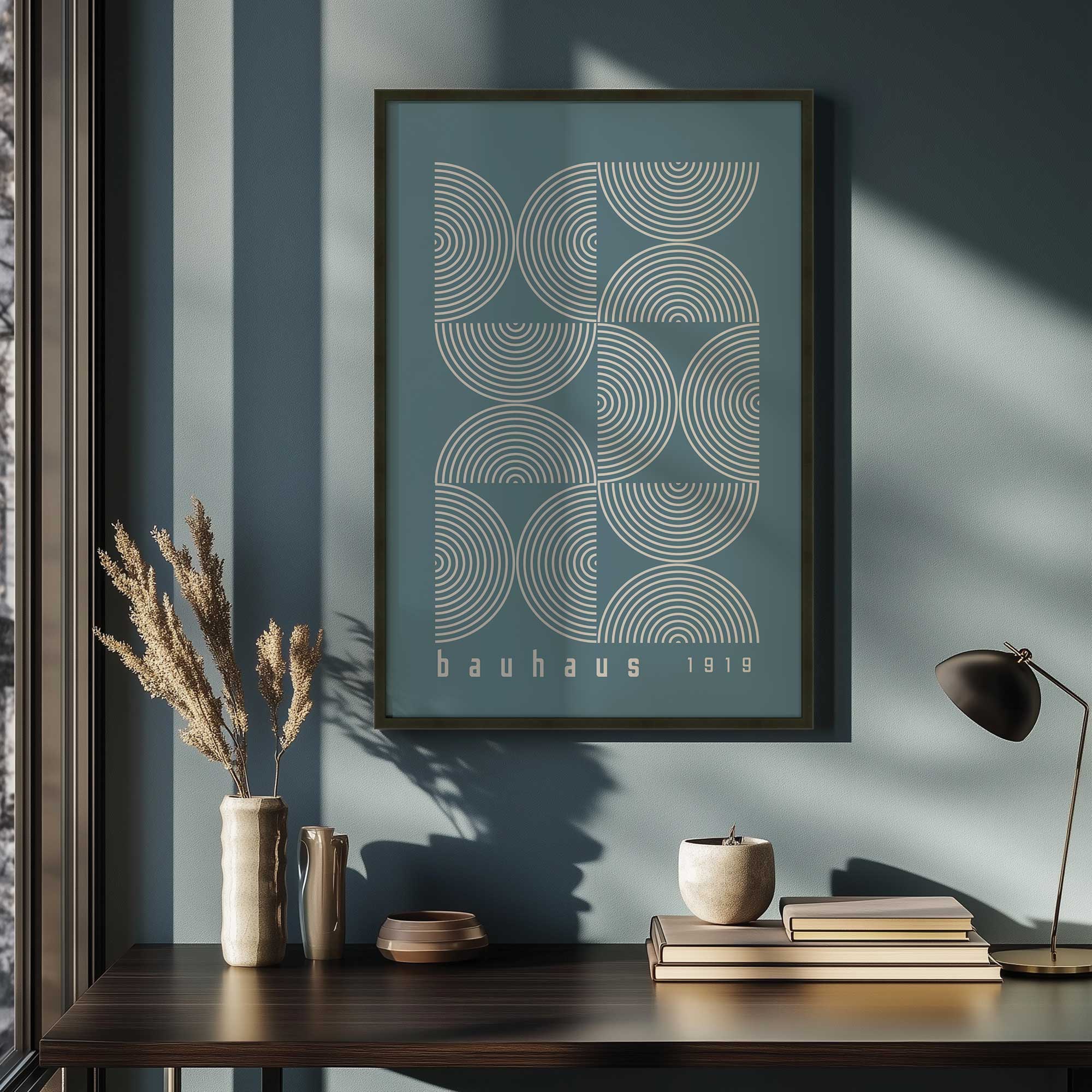 storm blue bauhaus composition poster II print in a black frame above a desk