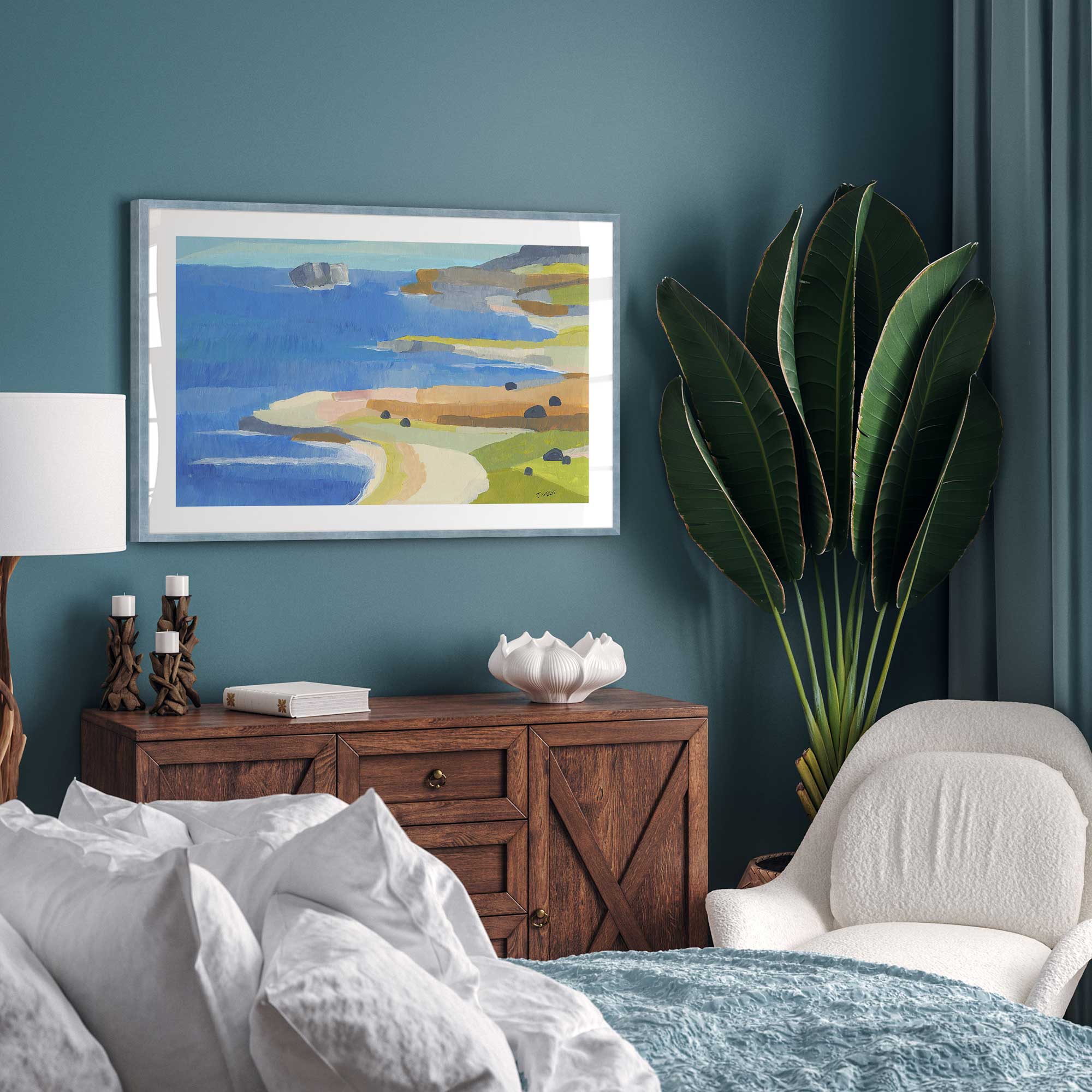 Irish Coastal Whimsy Print in a blue frame on a bedroom wall