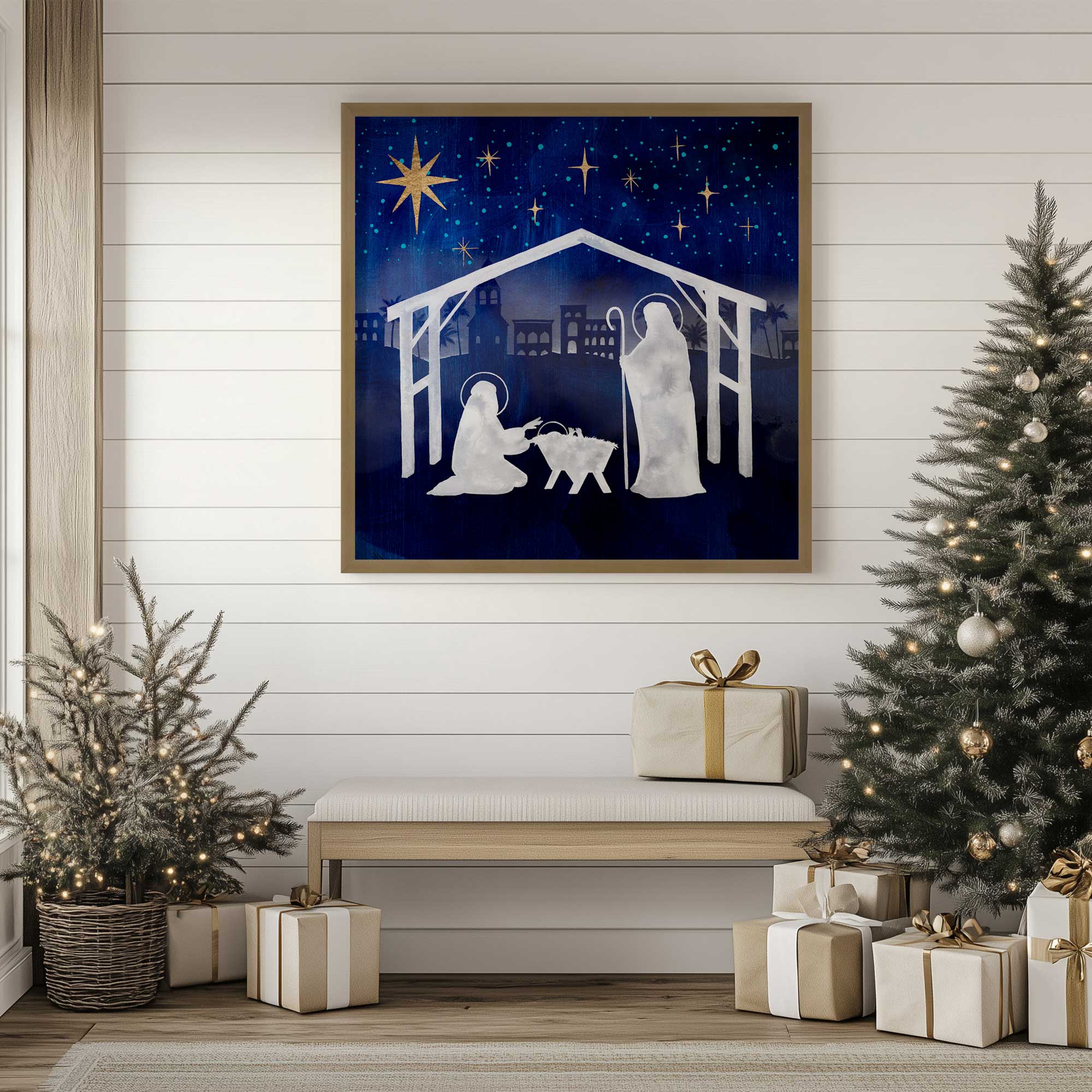 night sky nativity scene I print in a gold frame hanging above a bench