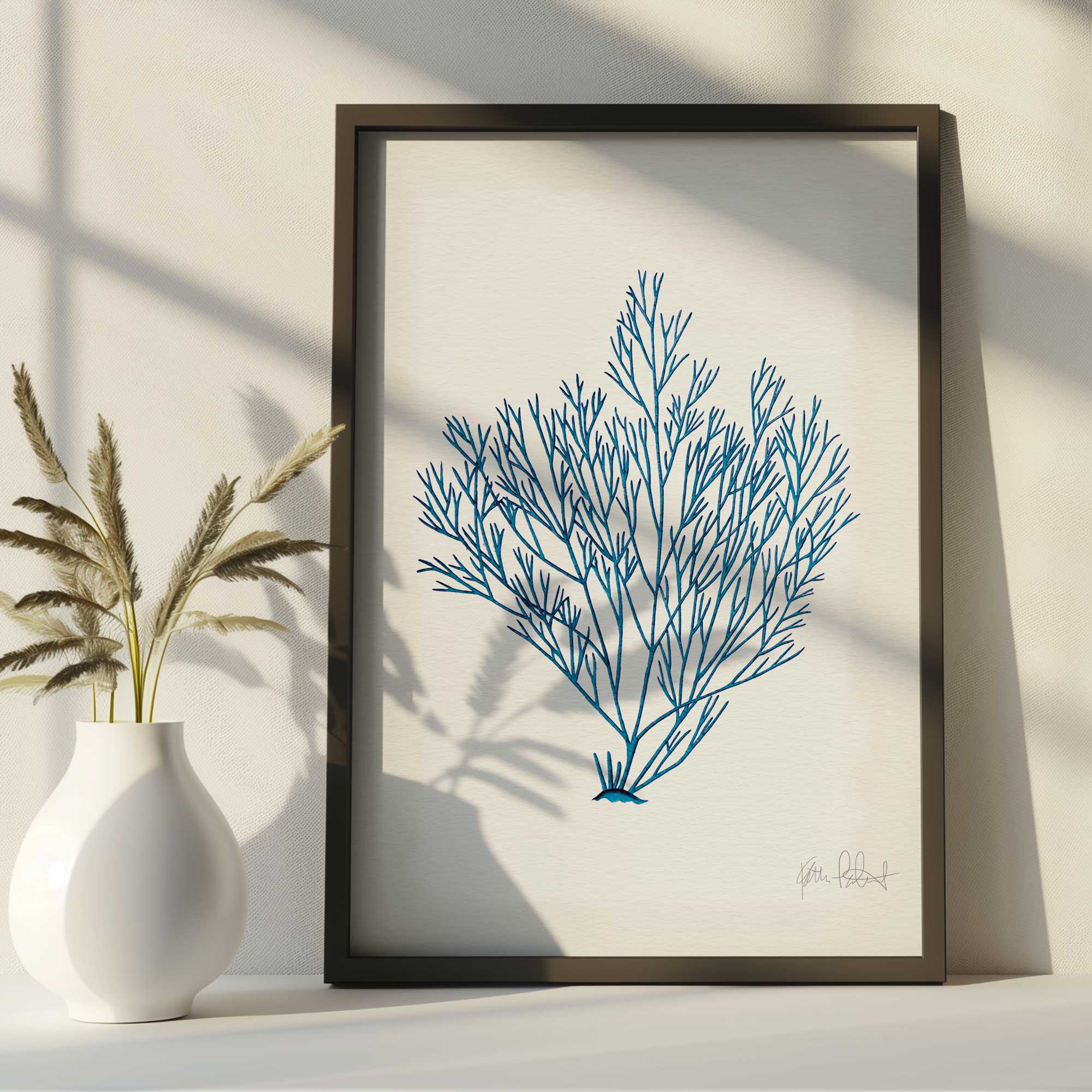 Nature's Blueprint print in a wooden frame on a counter