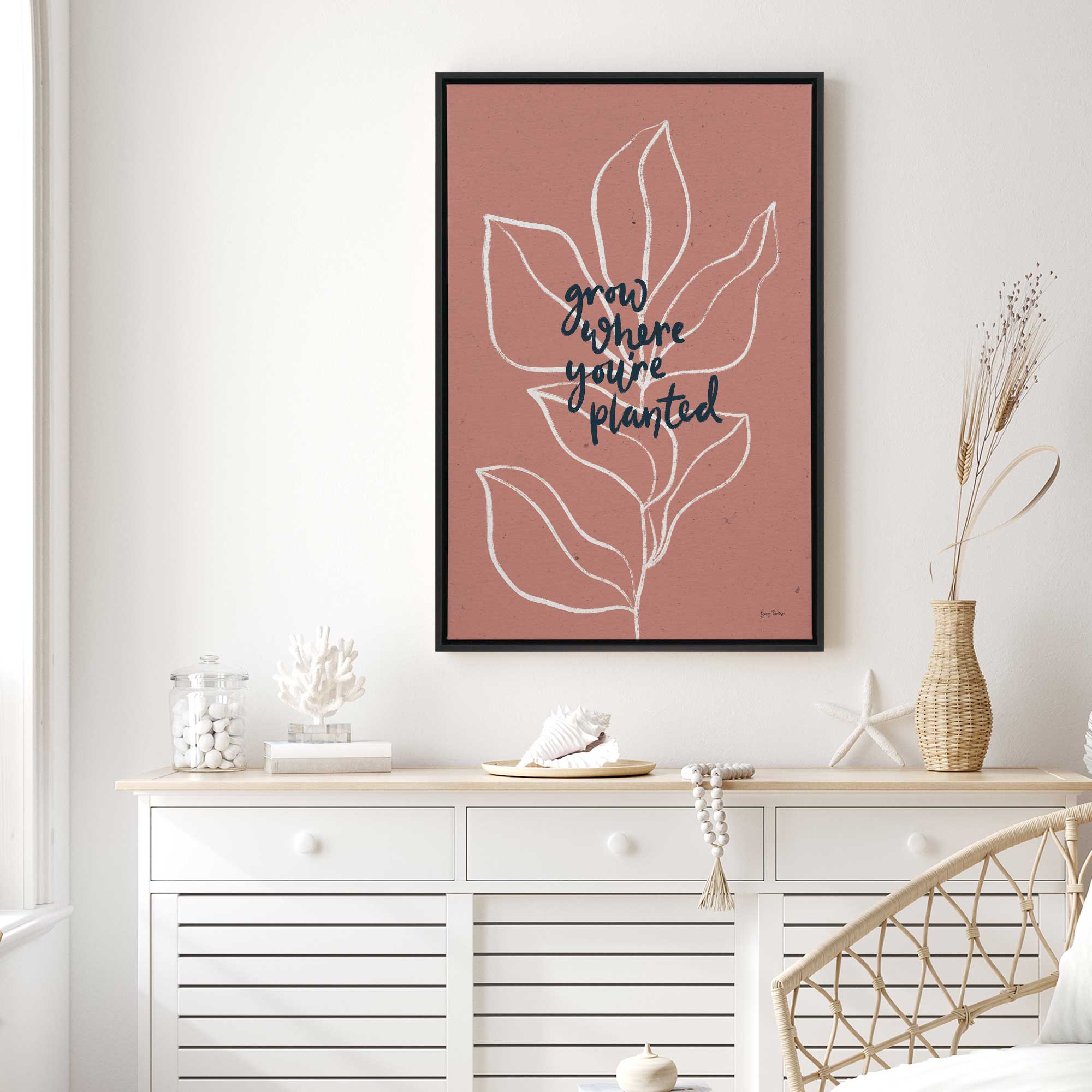 rooted in strength framed canvas print hanging in bedroom