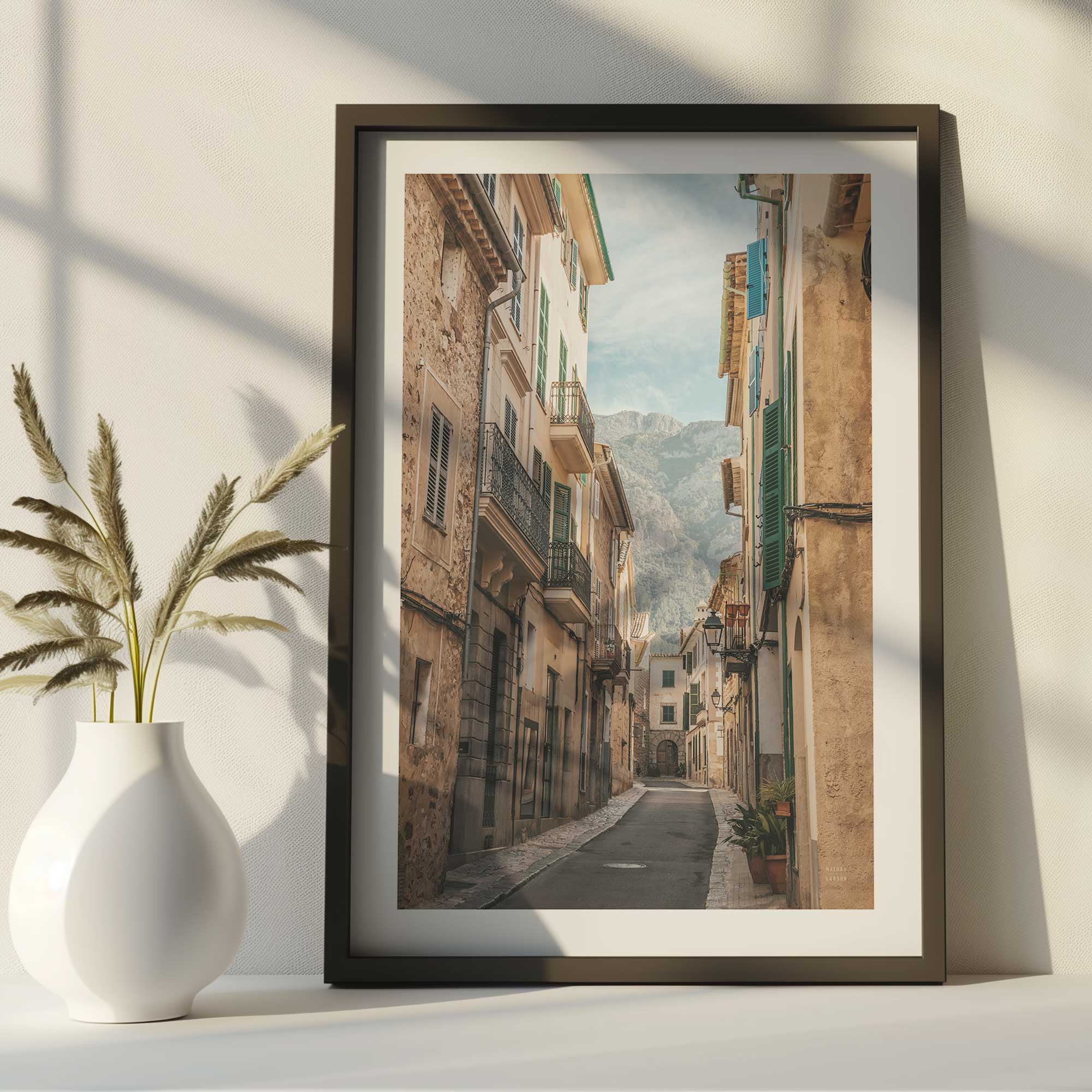 mountain village passage print framed and on a desk