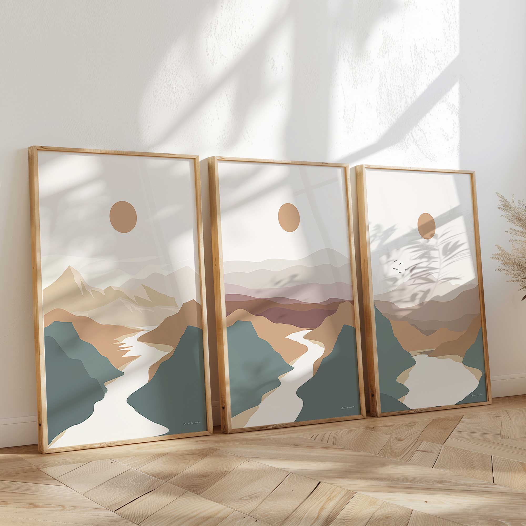 Minimalist Mountain Escape set of 3 prints in maple frames leaning against the wall