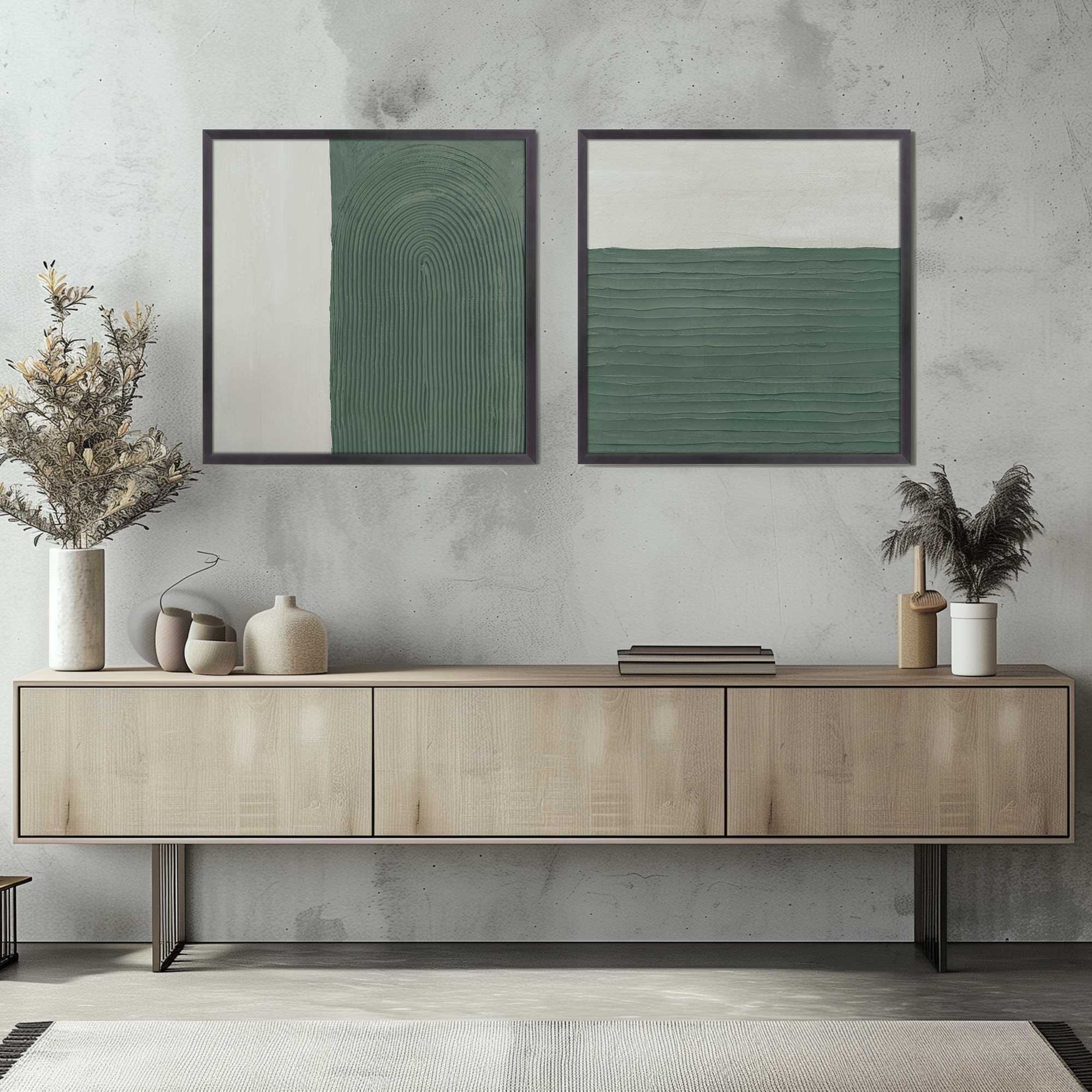 emerald echoes set of 2 framed prints hanging above console table in living room