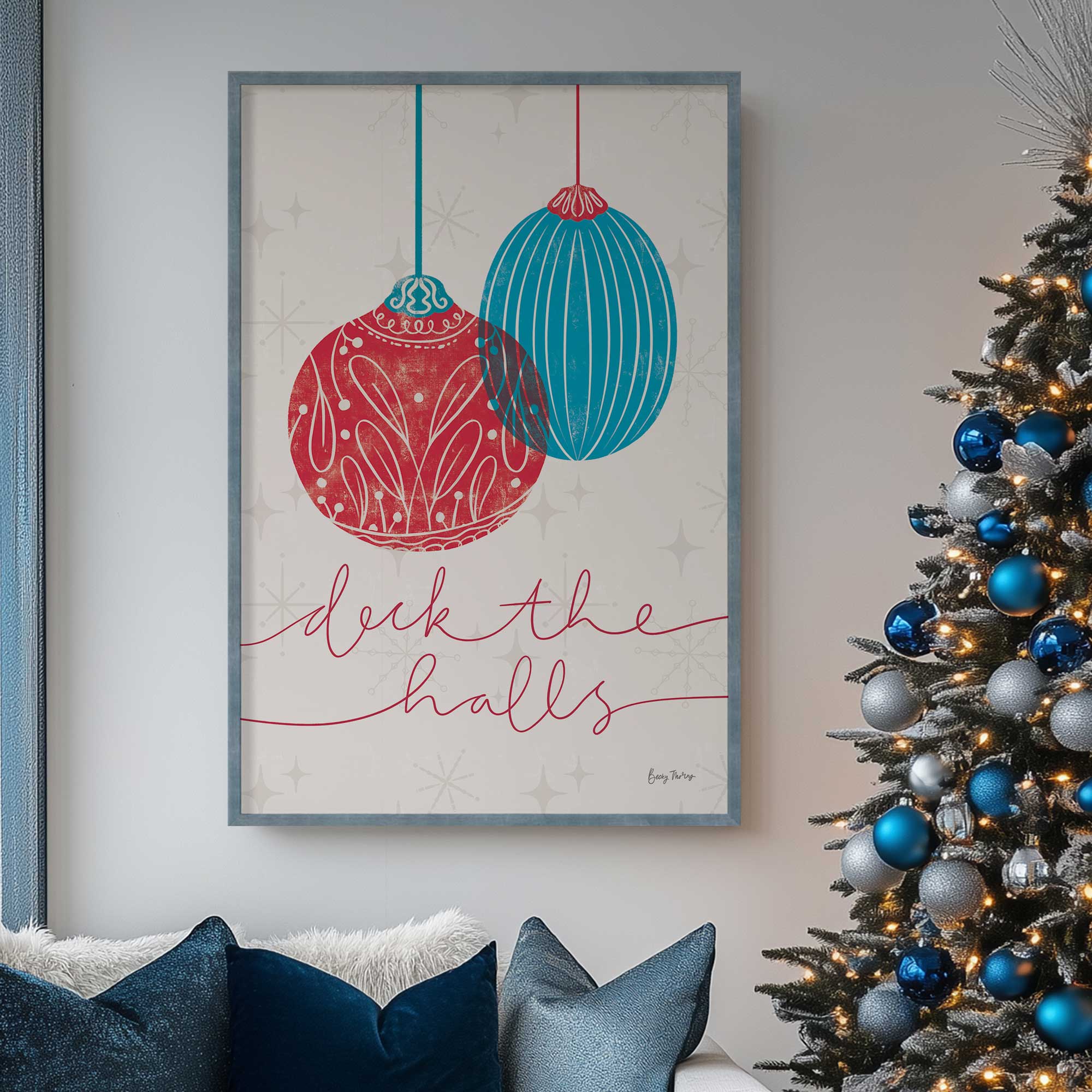 elegant holiday ornaments V print hanging above couch beside Christmas tree