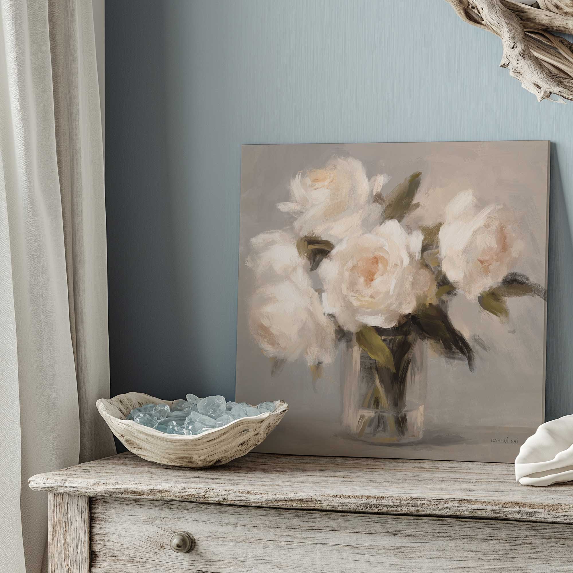 Ivory Bloom Stillness stretched canvas art print leaning on a dresser