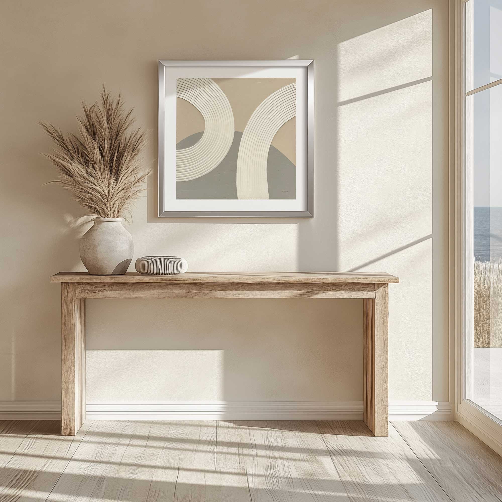 rhythm in neutral shades I print hanging above a Scandinavian-style onsole table