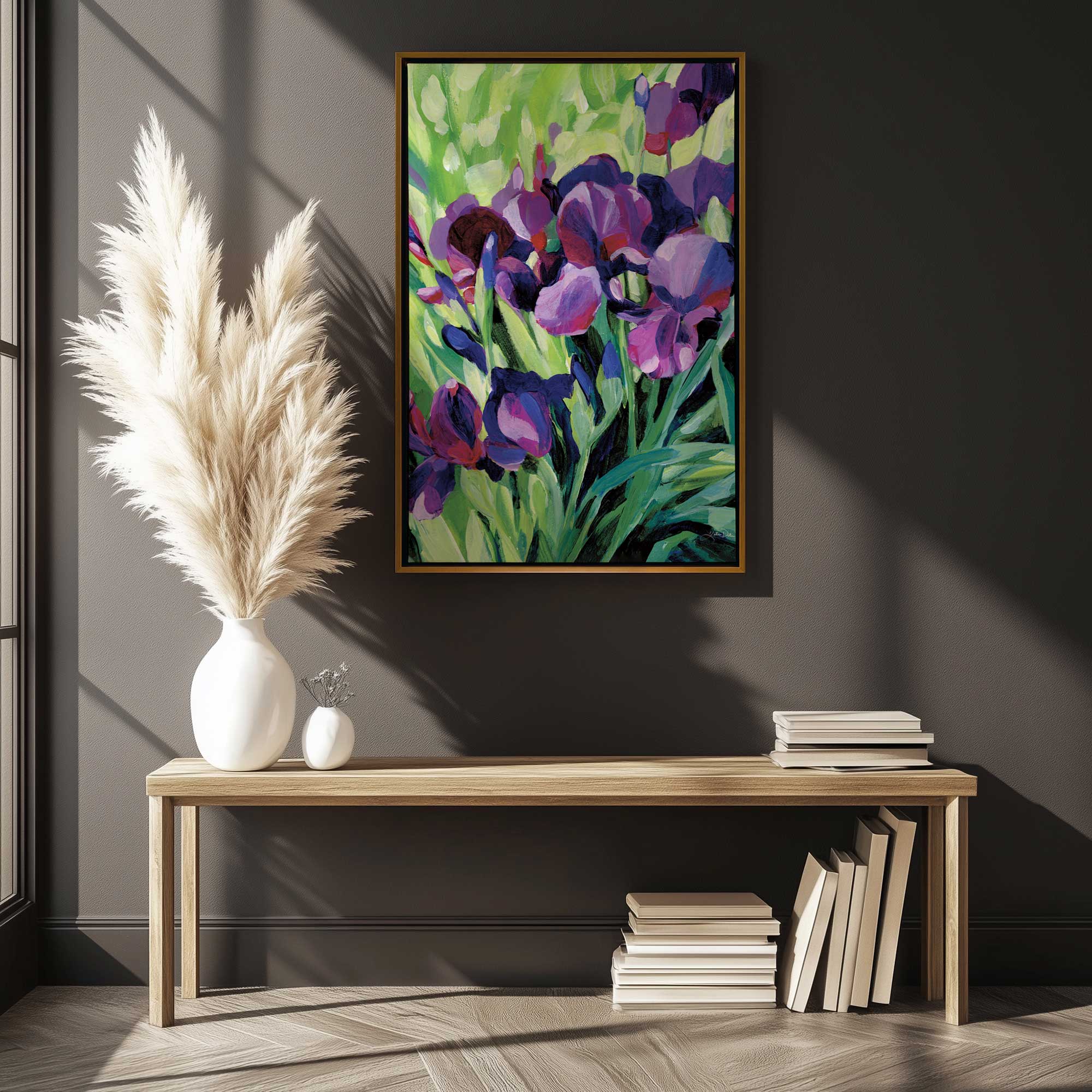 Bold iris blooms painting on canvas hanging above a bench