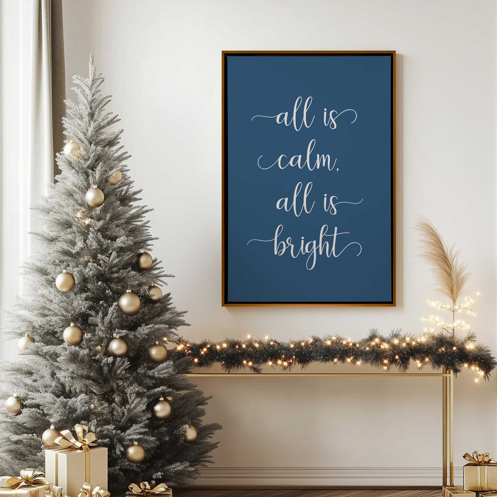 all is calm navy Christmas art print on canvas in a gold floater frame hanging by the tree