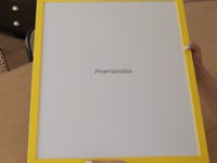 [LIFESTYLE],Sunburst Yellow Narrow Width Wall Frame in a room